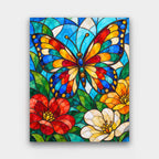 Jewel Glass Butterfly paint by numbers kit of a stained-glass butterfly among red and white flowers in jewel colors with dark leading