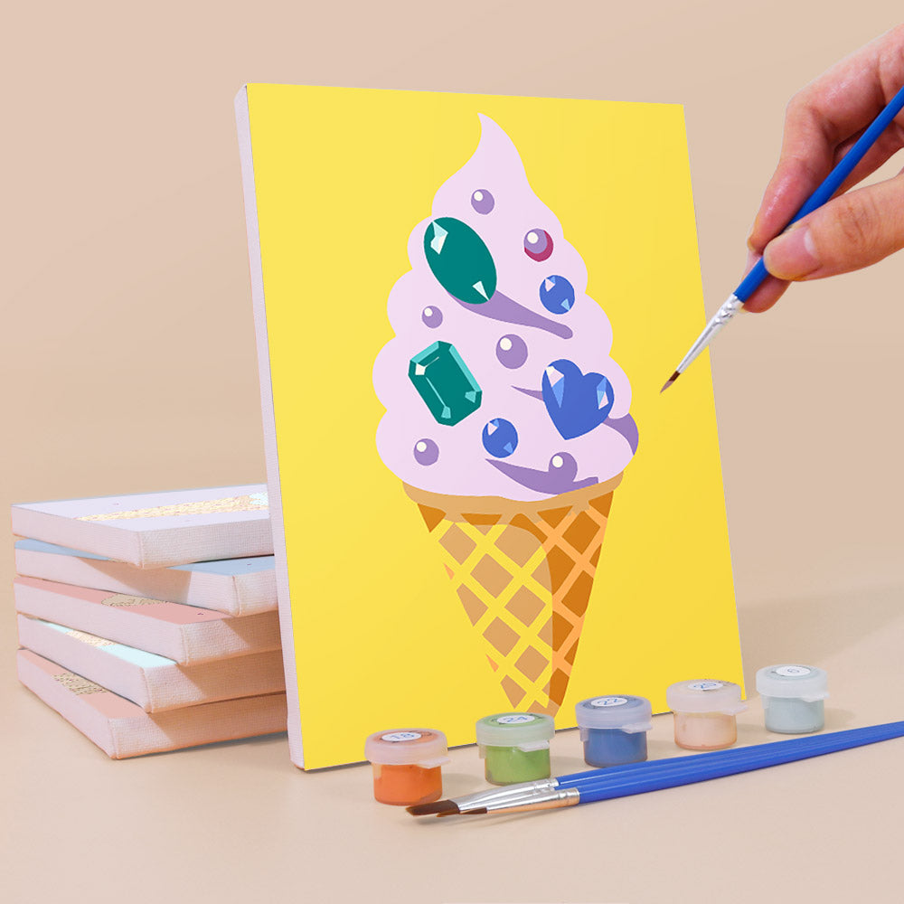 Painting a Jeweled Cones mini canvas propped up beside numbered acrylic paints