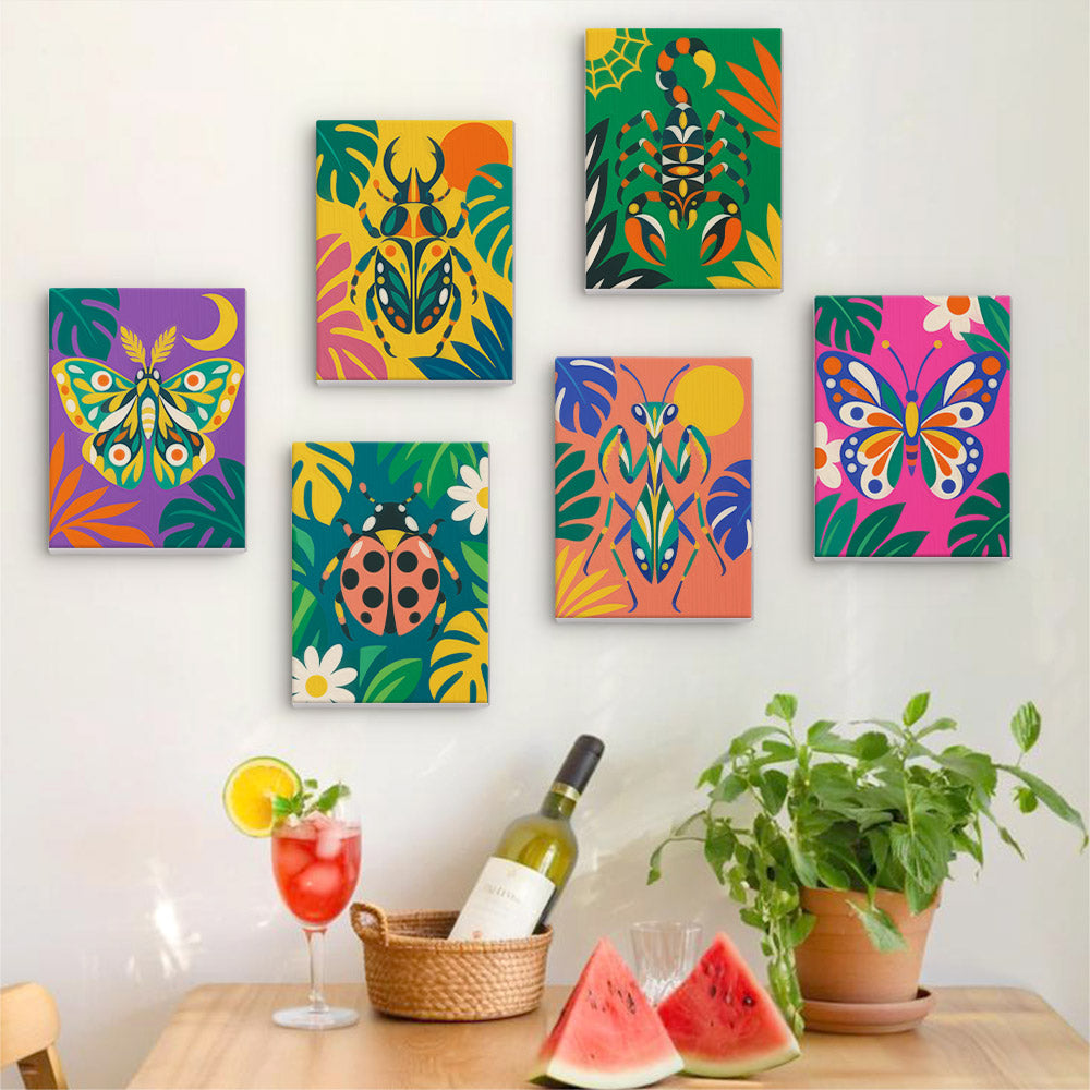 Six finished Jungle Bugs mini paintings hung on a wall above a table
