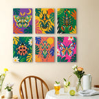 Jungle Bugs mini paintings displayed as a gallery wall in a sunny kitchen