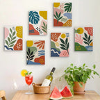 Six finished Jungle Collage mini paintings hung on a wall above a table