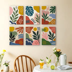 Jungle Collage mini paintings displayed as a gallery wall in a sunny kitchen