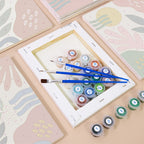 Numbered paint pots and brushes on a pre-stretched Jungle Collage mini canvas