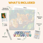 What's included in the Jungle Spirit paint by numbers kit: numbered linen canvas, reference sheet, color guide, 24 acrylic paints, 3 brushes and thank you card