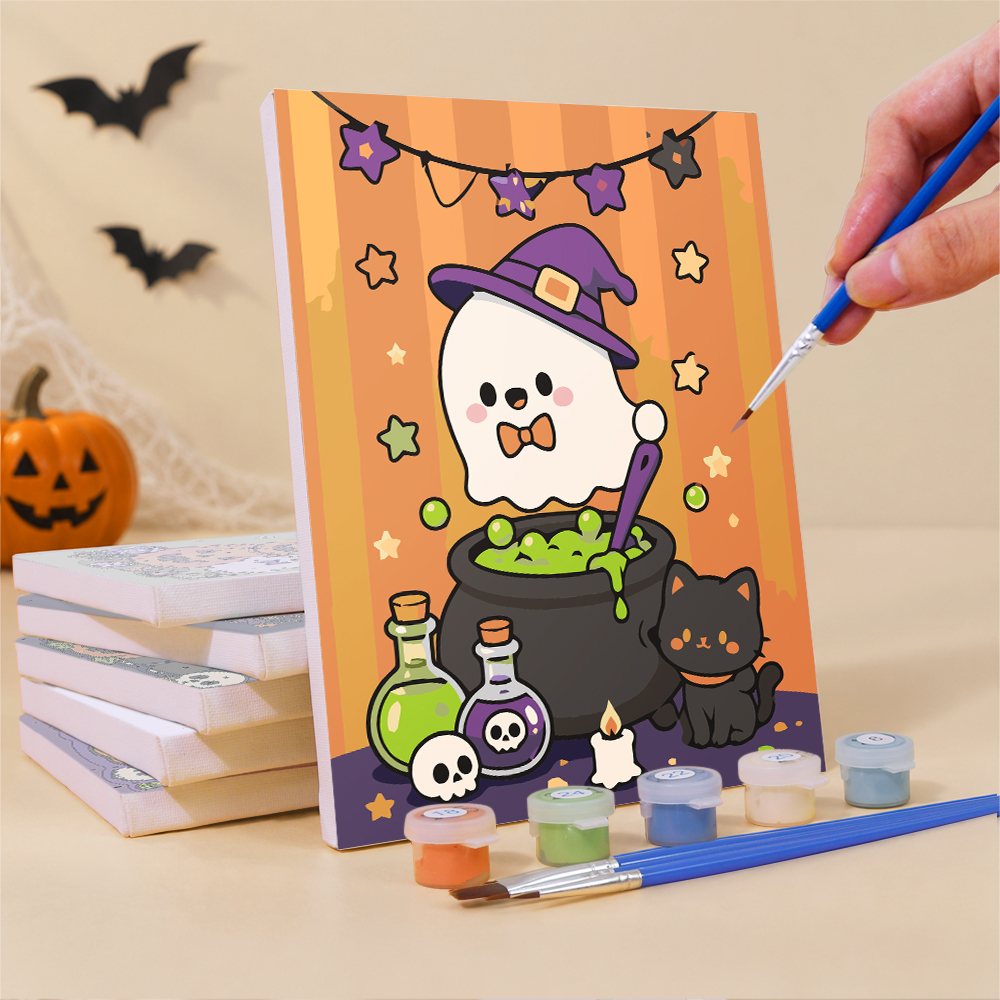 Painting a Kawaii Halloween mini canvas propped up beside numbered acrylic paints