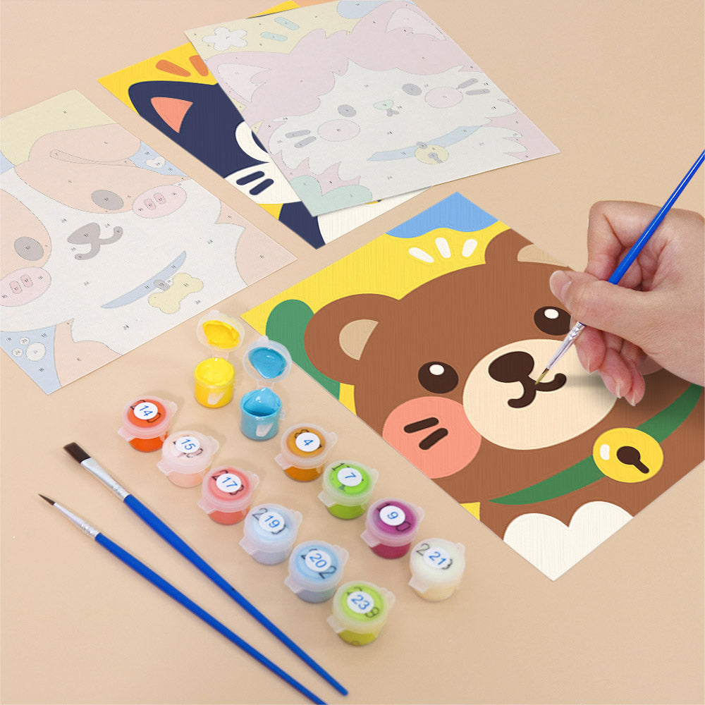 Filling in a Kawaii Pals mini canvas with numbered acrylic paints and a fine brush