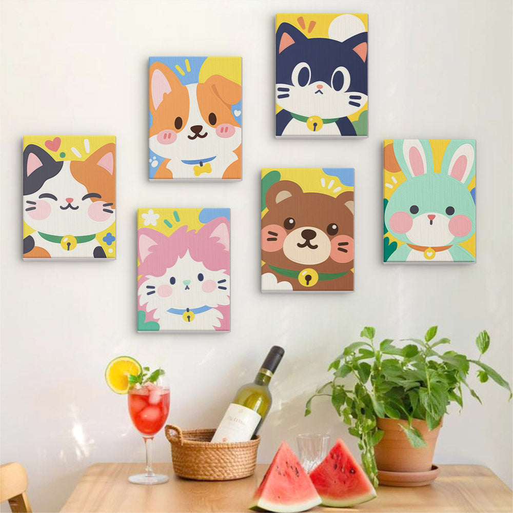 Six finished Kawaii Pals mini paintings hung on a wall above a table