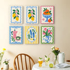 Kitchen Charm mini paintings displayed as a gallery wall in a sunny kitchen