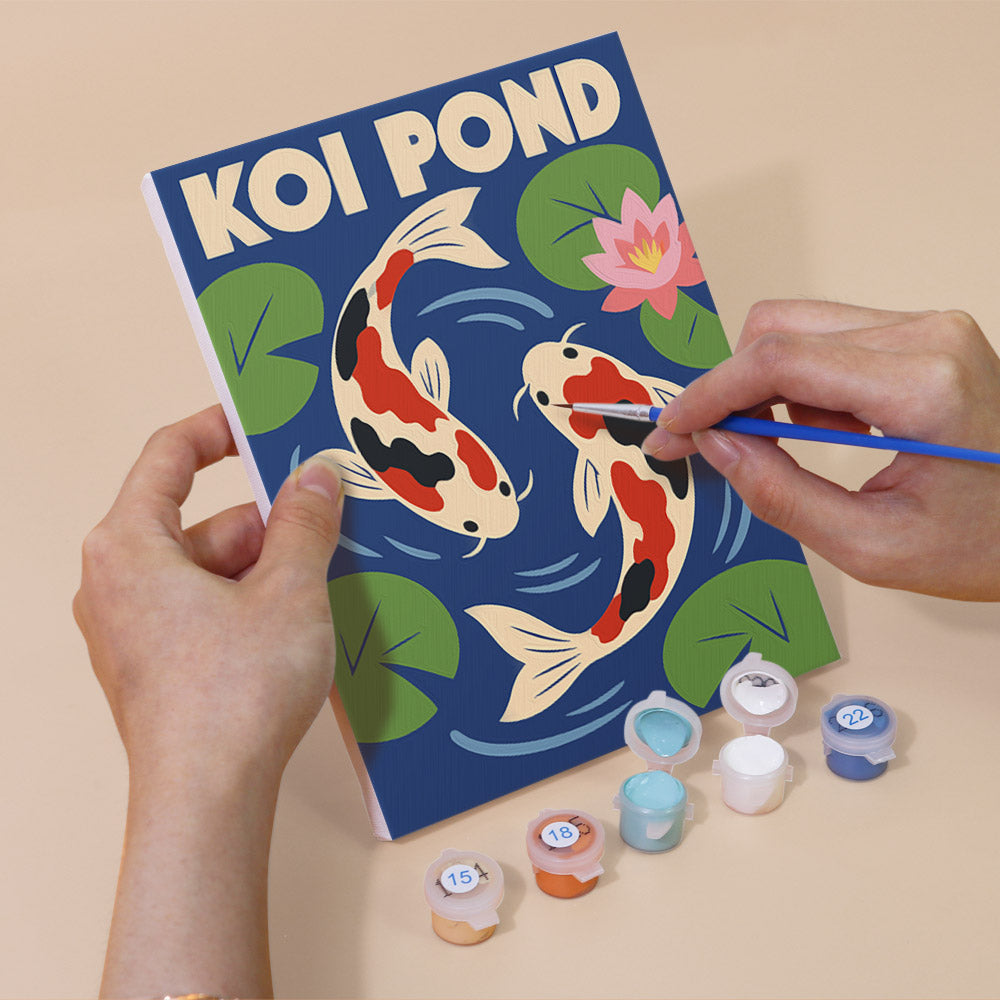 Hand holding a Kyoto Posters mini canvas while painting the details