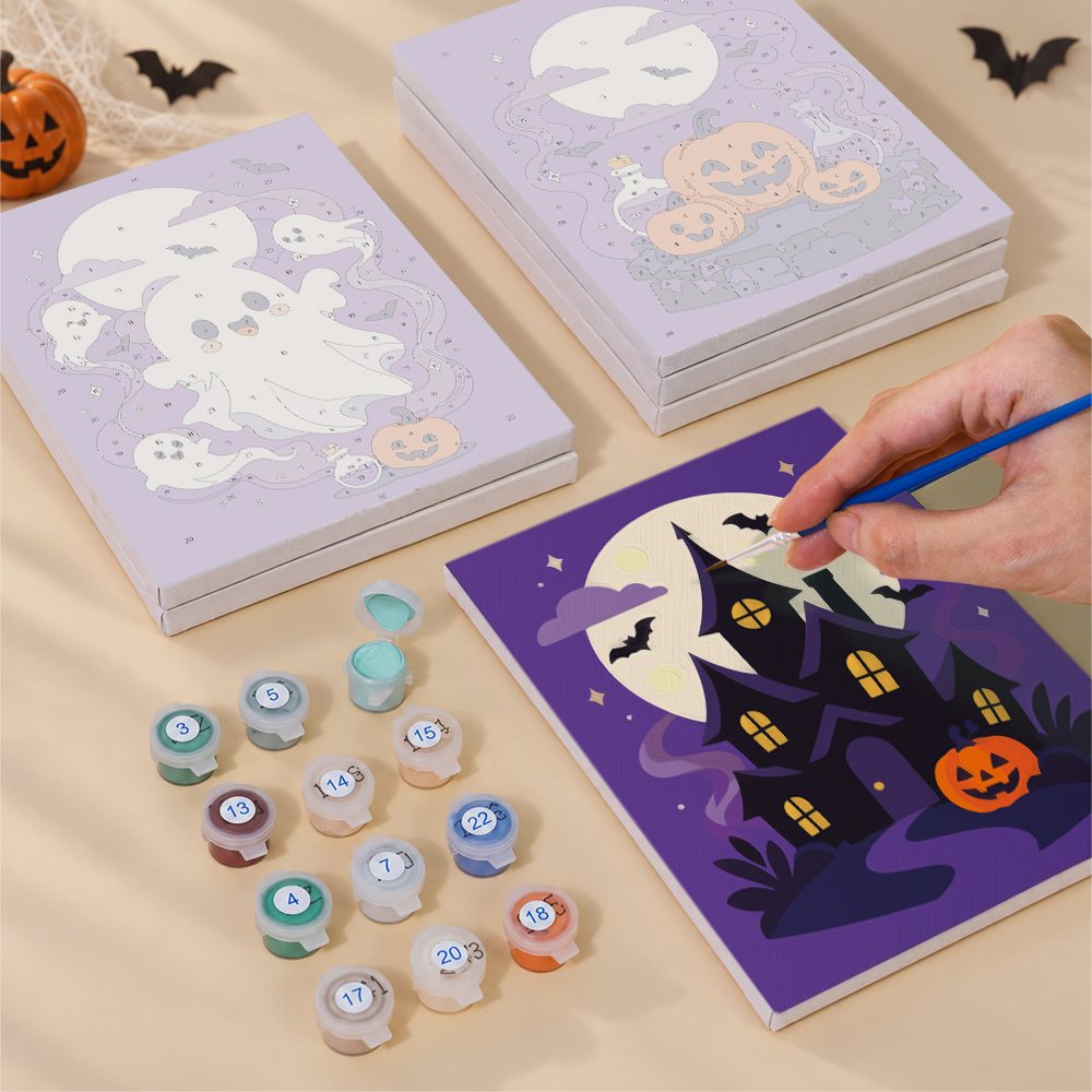 Painting one of the Lavender Hauntings designs next to a stack of mini canvases
