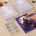 Painting one of the Lavender Hauntings designs next to a stack of mini canvases