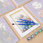 Numbered paint pots and brushes on a pre-stretched Lavender Hauntings mini canvas