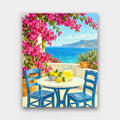 Lemonade by the Sea paint by numbers kit of a sunny terrace with blue chairs, lemonade and magenta bougainvillea above a turquoise sea