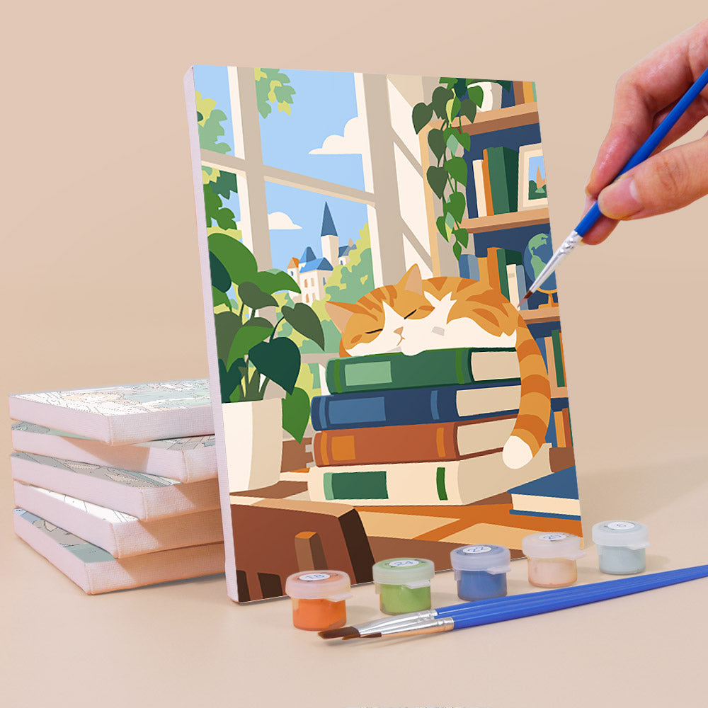 Painting a Library Hours mini canvas propped up beside numbered acrylic paints