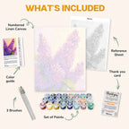 What's included in the Lilac Symphony paint by numbers kit: numbered linen canvas, reference sheet, color guide, 24 acrylic paints, 3 brushes and thank you card