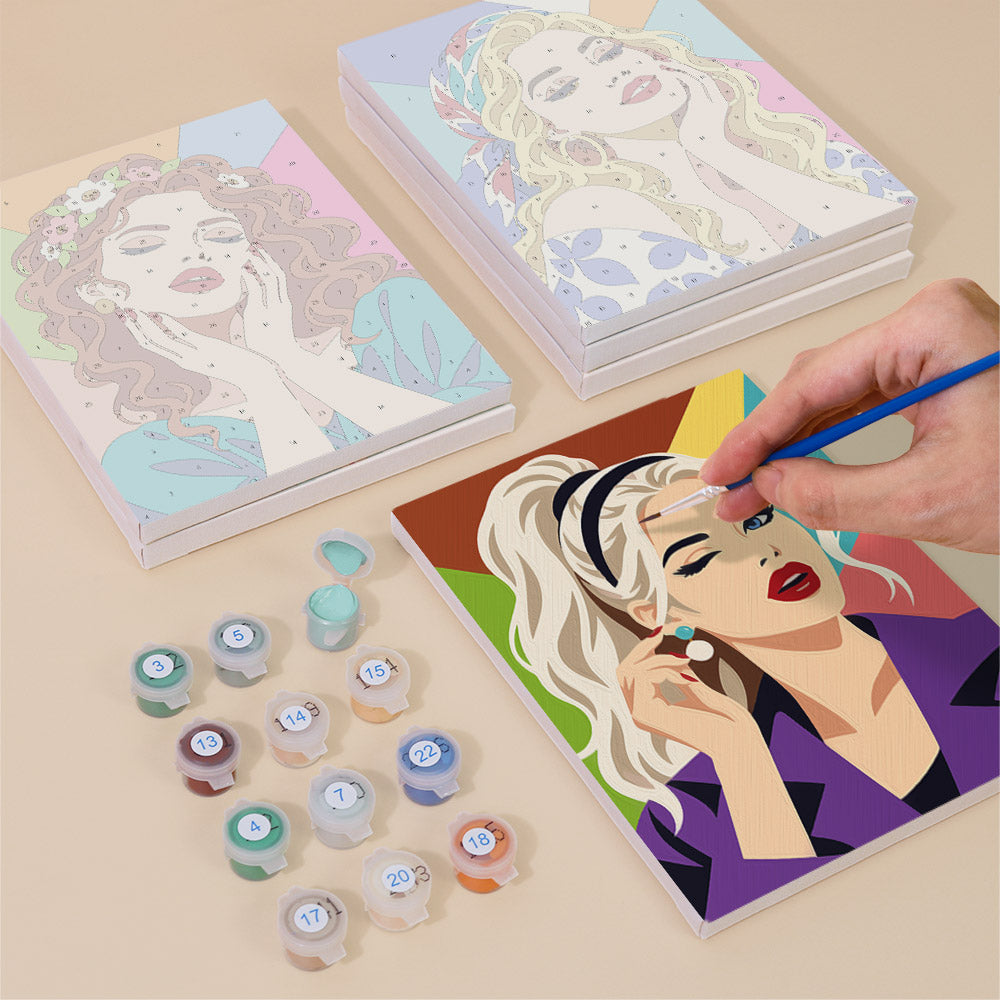 Painting one of the Lipstick & Attitude designs next to a stack of mini canvases