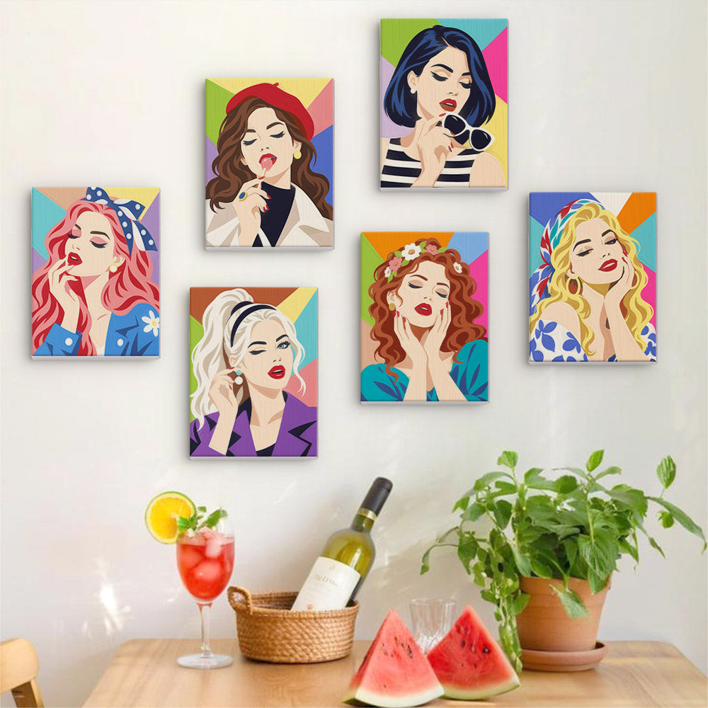 Six finished Lipstick & Attitude mini paintings hung on a wall above a table