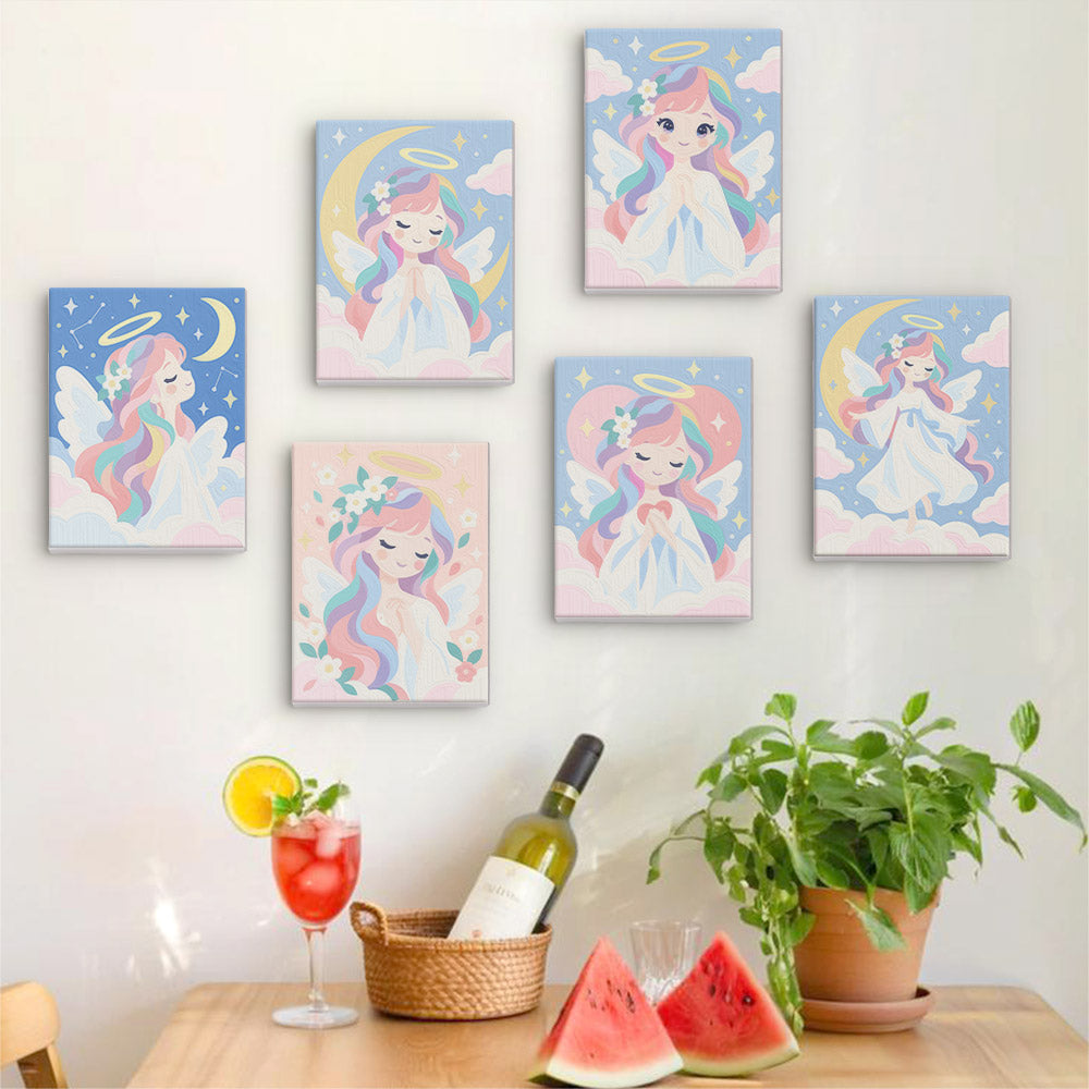 Six finished Little Angels mini paintings hung on a wall above a table