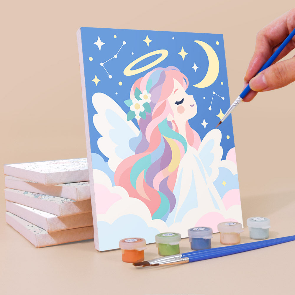 Painting a Little Angels mini canvas propped up beside numbered acrylic paints