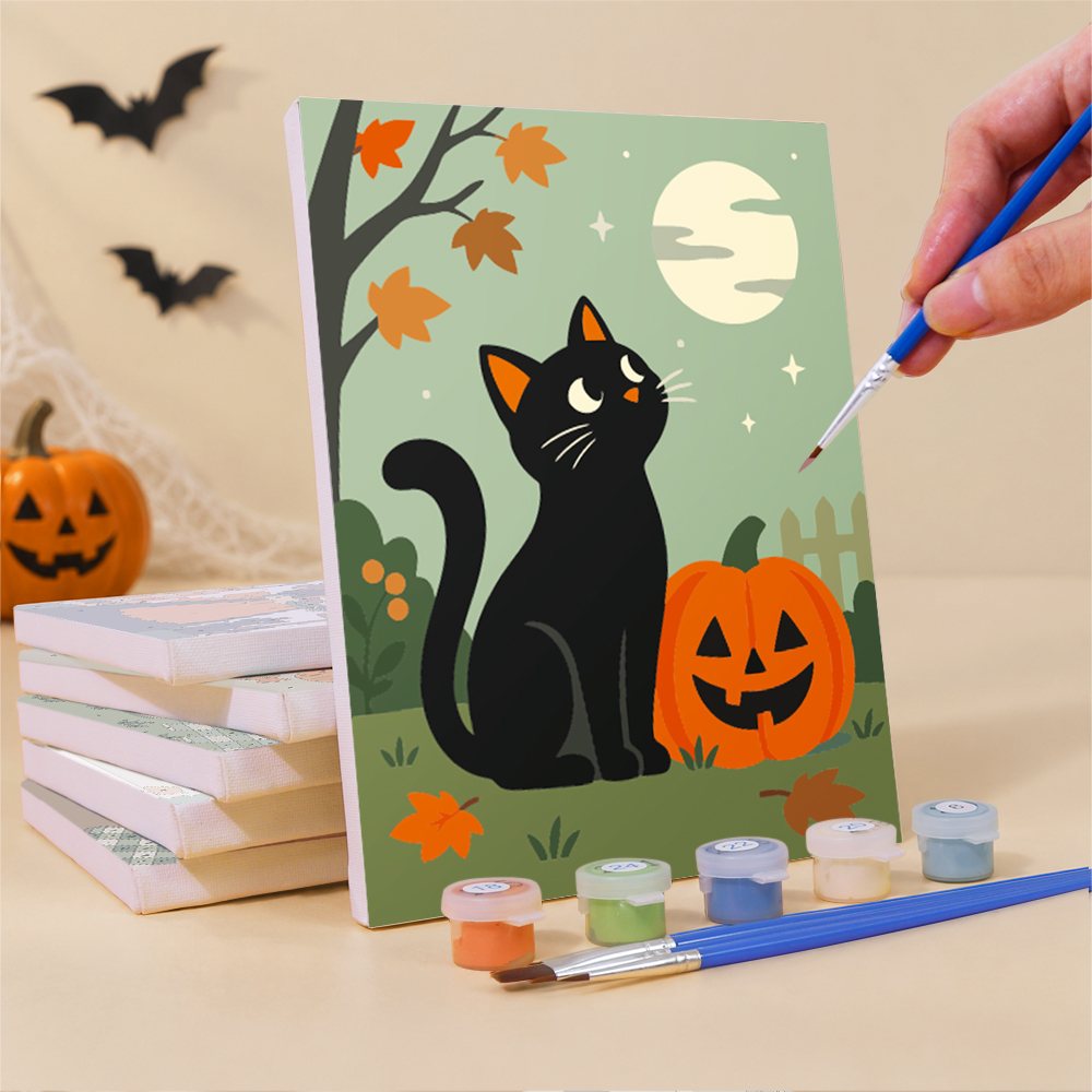 Painting a Little Autumn Witches mini canvas propped up beside numbered acrylic paints