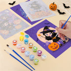 Filling in a Little Witch Adventures mini canvas with numbered acrylic paints and a fine brush