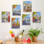 Six finished London Days mini paintings hung on a wall above a table
