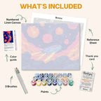 What's included in the Lost in the Nebula paint by numbers kit: numbered linen canvas, reference sheet, color guide, 24 acrylic paints, 3 brushes and thank you card