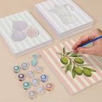 Painting one of the Market Stripes designs next to a stack of mini canvases