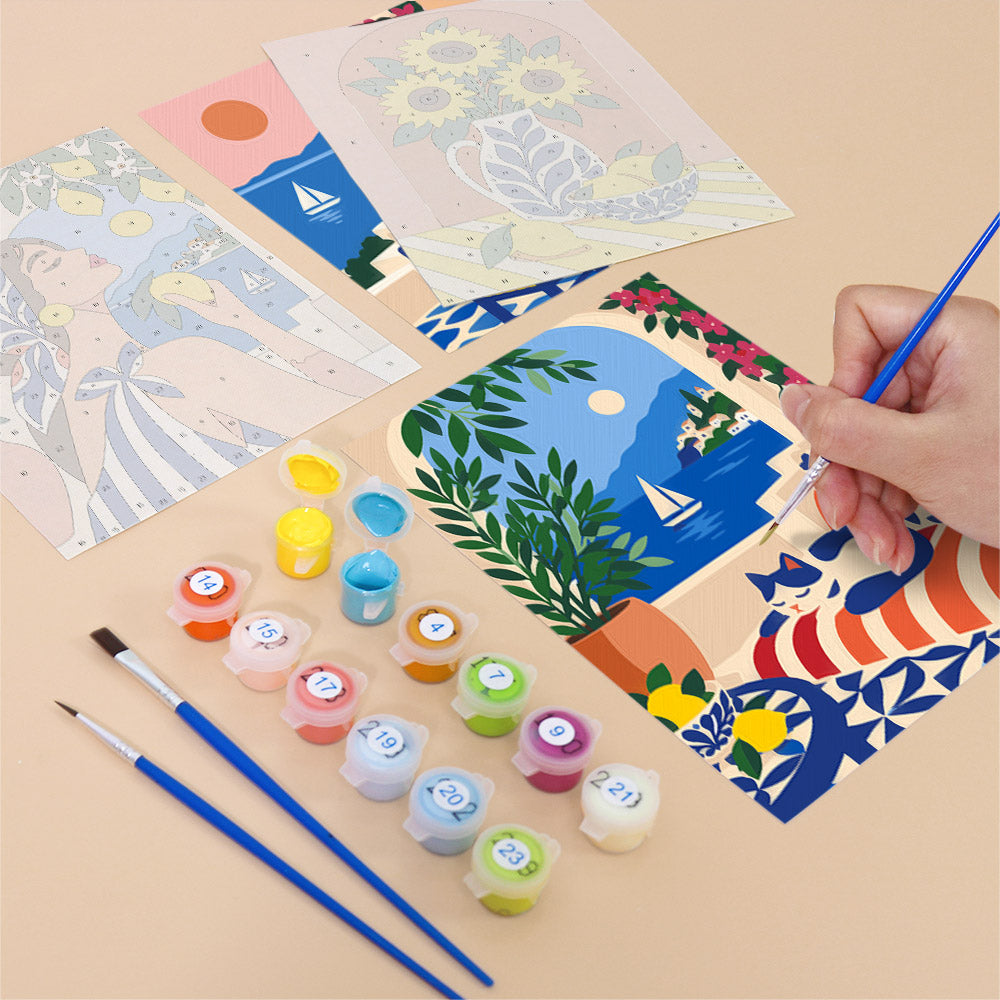 Filling in a Mediterranean Summer mini canvas with numbered acrylic paints and a fine brush