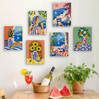 Six finished Mediterranean Summer mini paintings hung on a wall above a table