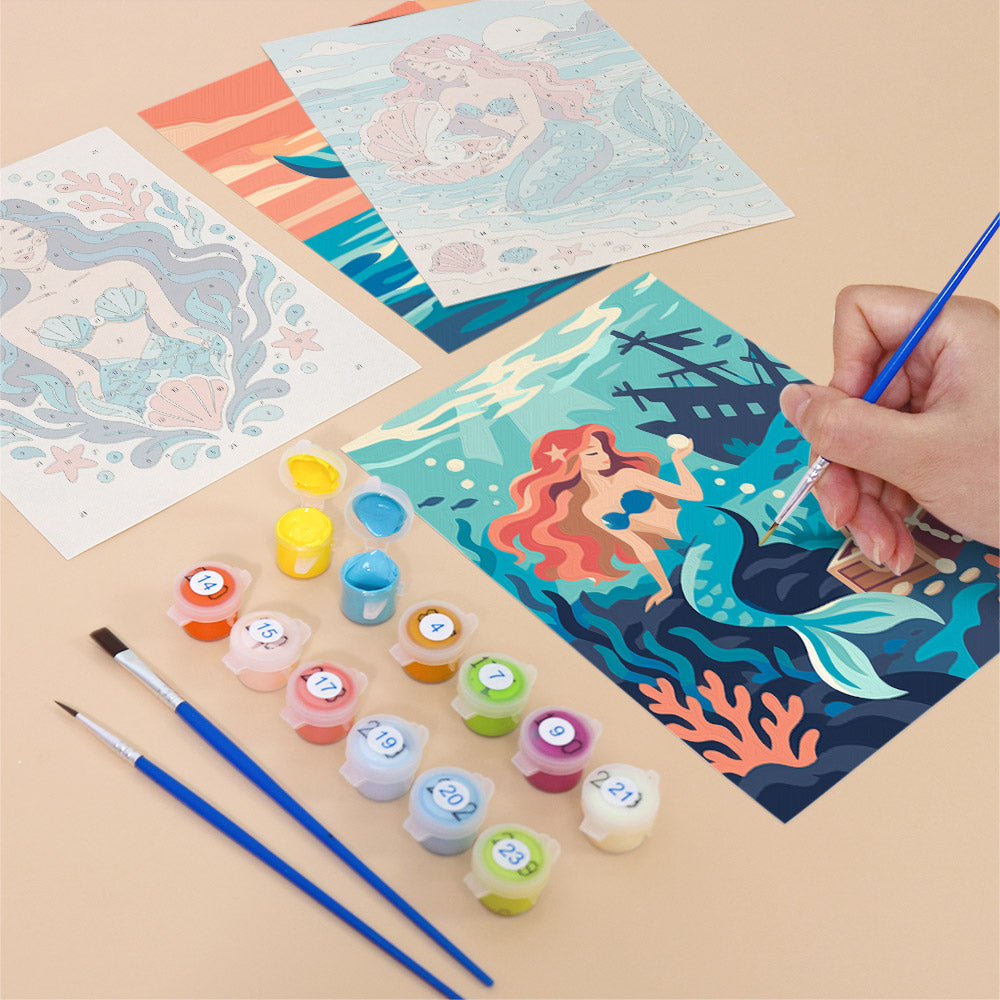 Filling in a Mermaid Tales mini canvas with numbered acrylic paints and a fine brush