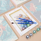 Numbered paint pots and brushes on a pre-stretched Mermaid Tales mini canvas