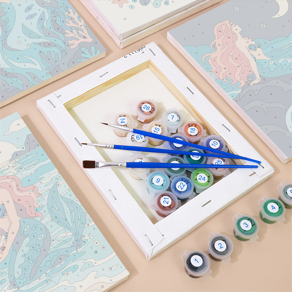 Numbered paint pots and brushes on a pre-stretched Mermaid Tales mini canvas