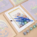 Numbered paint pots and brushes on a pre-stretched Midnight Friends mini canvas