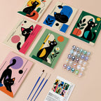 Mod Cats mini paint by numbers kit with six numbered canvases, acrylic paints, brushes and layout