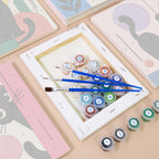 Numbered paint pots and brushes on a pre-stretched Mod Cats mini canvas