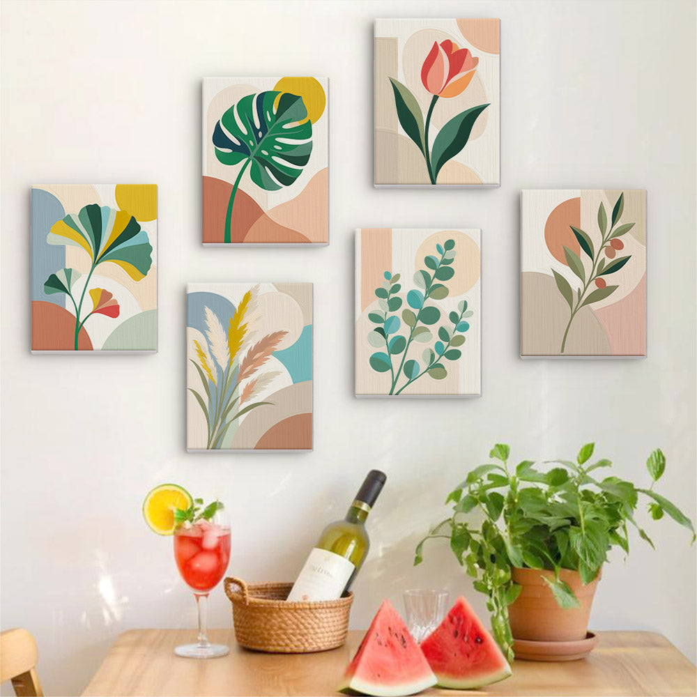 Six finished Modern Leaves mini paintings hung on a wall above a table