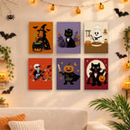 Six finished Monster Mash mini paintings hung on a wall above a table