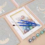 Numbered paint pots and brushes on a pre-stretched Moon Magic mini canvas
