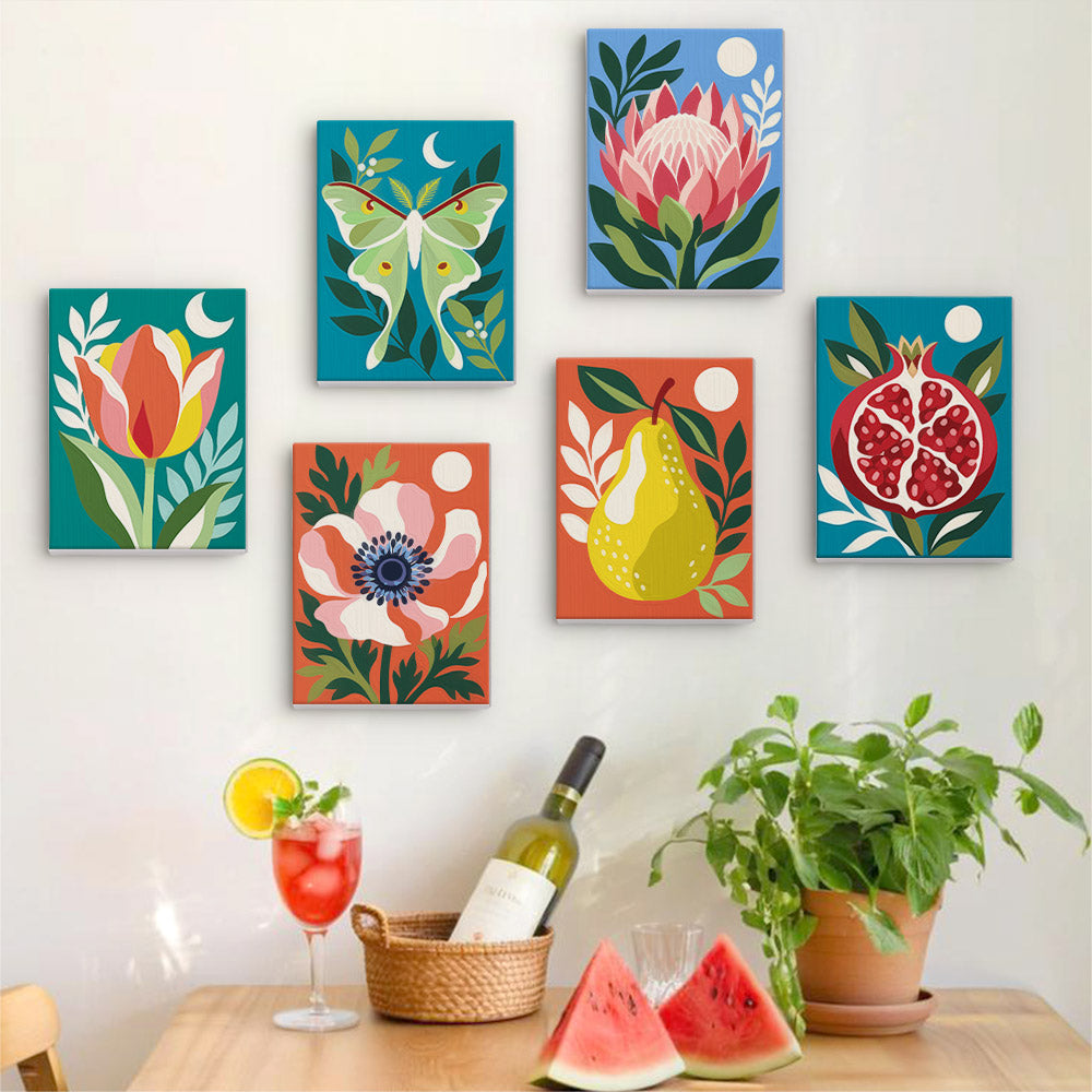 Six finished Moonlit Botanicals mini paintings hung on a wall above a table