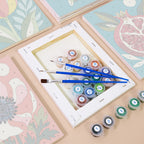 Numbered paint pots and brushes on a pre-stretched Moonlit Botanicals mini canvas