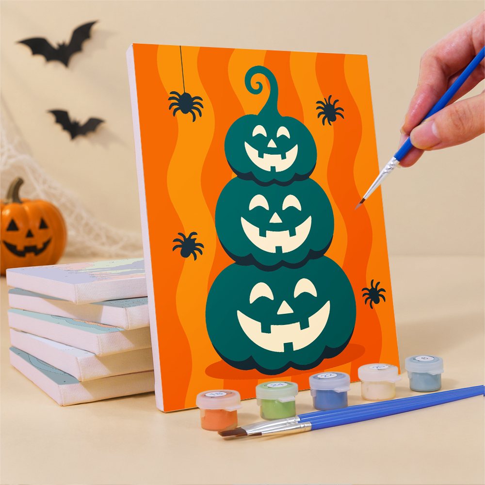 Painting a Moonlit Halloween mini canvas propped up beside numbered acrylic paints