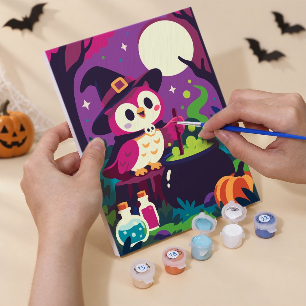 Numbered paint pots and brushes on a pre-stretched Moonlit Monster Meadows mini canvas