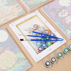 Moonlit Monster Meadows mini paintings displayed as a gallery wall in a sunny kitchen