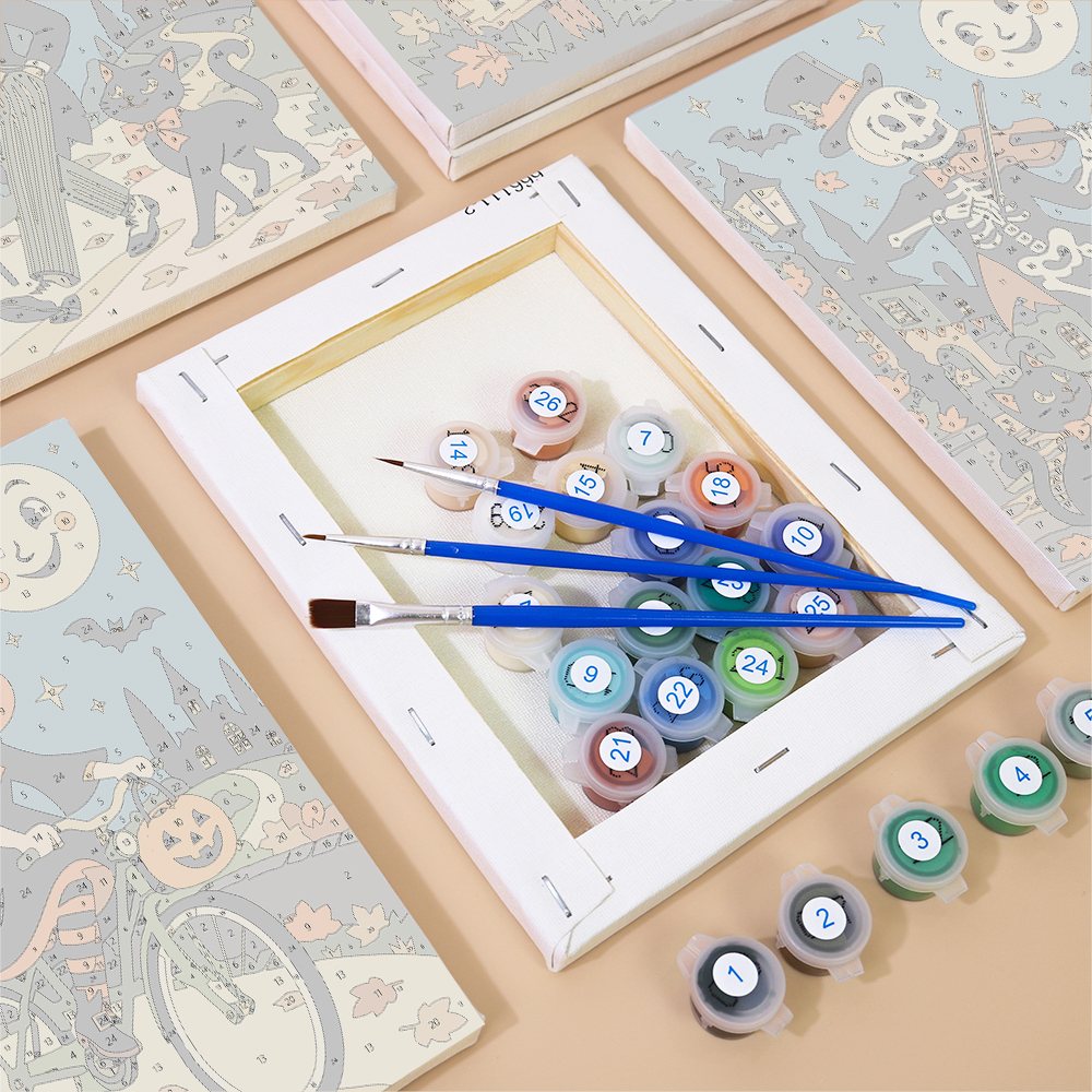 Moonlit Storybook Halloween mini paintings displayed as a gallery wall in a sunny kitchen