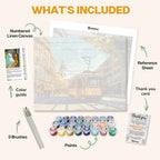 What's included in the Morning Tramway paint by numbers kit: numbered linen canvas, reference sheet, color guide, 24 acrylic paints, 3 brushes and thank you card