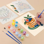 Filling in a Morning Treats mini canvas with numbered acrylic paints and a fine brush