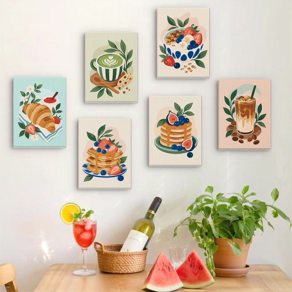 Six finished Morning Treats mini paintings hung on a wall above a table