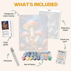 What's included in the Mushrooms at Midnight paint by numbers kit: numbered linen canvas, reference sheet, color guide, 24 acrylic paints, 3 brushes and thank you card