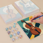 Painting one of the Music Makers designs next to a stack of mini canvases